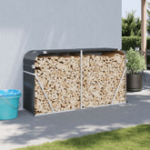 Anthracite galvanized steel log holder against a wall, filled with stacked firewood.